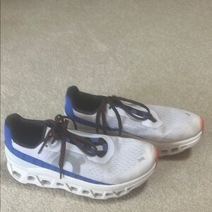 On Running White and Blue Sneakers with Modern Cushioning